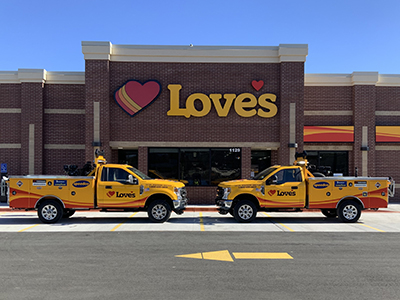 An exterior shot of Store 796 in Newport with Roadside Assistance trucks