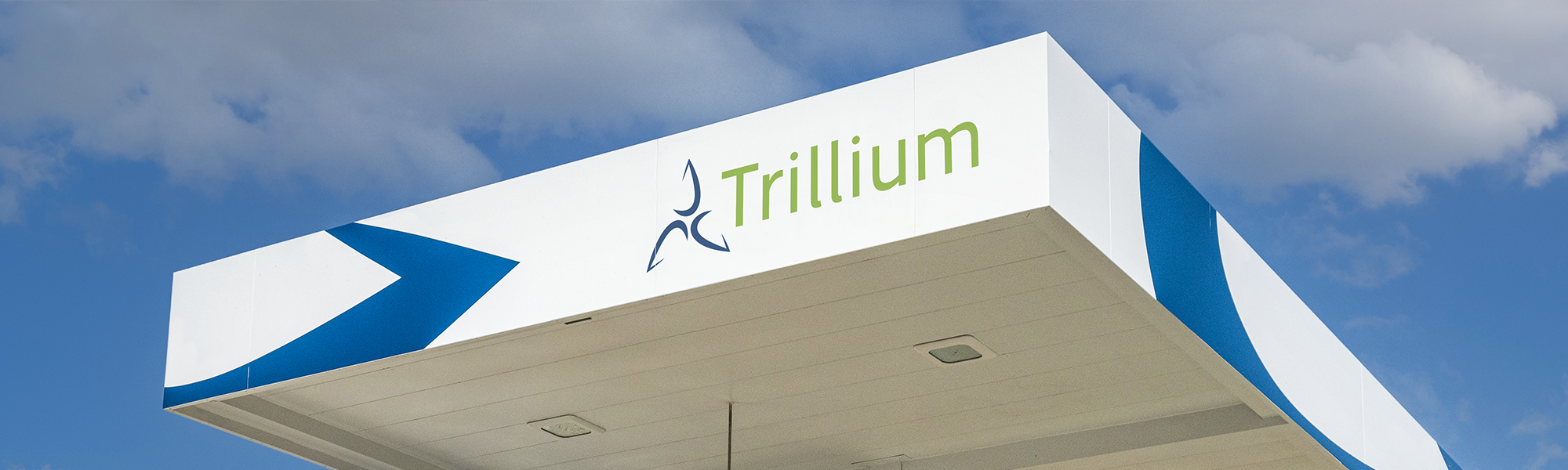 A Trillium station canopy with the sky in the background